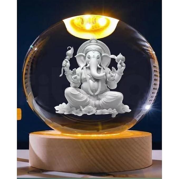 Ganesh Crystal LED Lamp - Shoppingstore25Shoppingstore258121759318The Ganesh Crystal LED Lamp features a white 3D LED image of Lord Ganesha seated cross - legged with four arms, set on a wooden base and illuminated by a glowing light above.